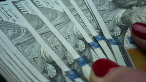 closeup female hands holding money cash. businesswoman hands counting banknotes