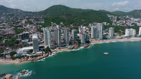 beautiful aerial dolly in establishing shot of playa condesa beach, mexico city