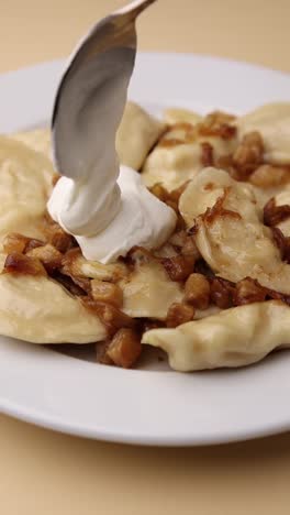 pierogi with sour cream