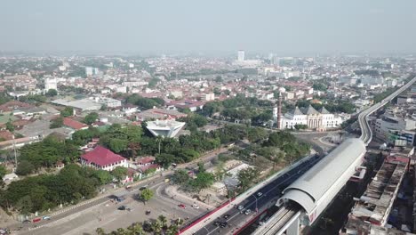 ampera public train station, monpera and the great mosque of palembang city