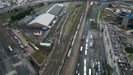 Trains-passing-on-railroad,-La-Villette,-Paris-in-France