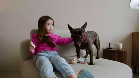 girl playing with dog