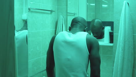 African-American-Man-Brushing-Teeth-in-Bathroom