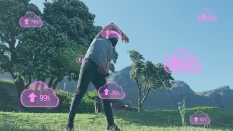 animation of clouds with percentage over senior african american man stretching at beach