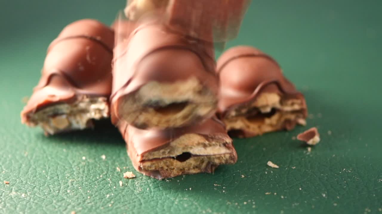 Broken Chocolate Bars on Green Surface