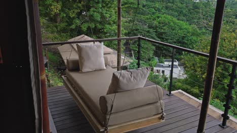 hanging swing chair on balcony of glamping tent