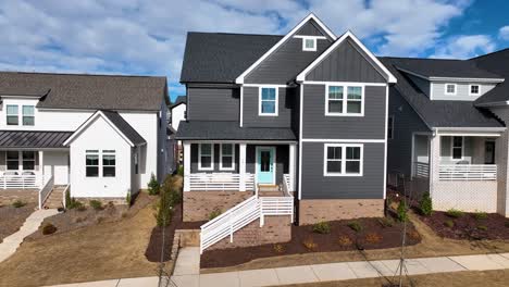 Aerial-View-Approaching-A-Modern-Family-House-In-A-Neighborhood,-During-Sunny-Day