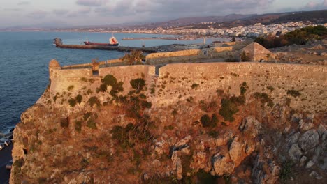 drone liftoff near the venetian fortezza citadel in the city rethymno - drone flight at sunset in greece crete