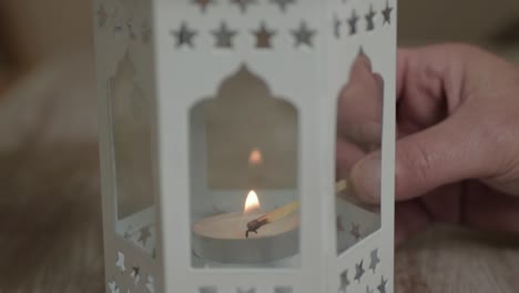 matchstick lighting a candle in a lantern-1