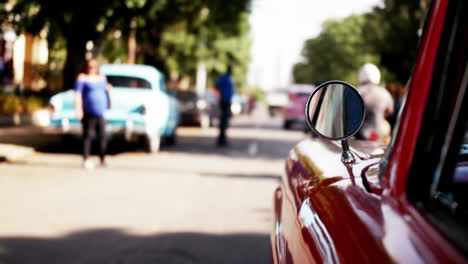 selective focus of the side of a car driving along the streets of havana in cuba