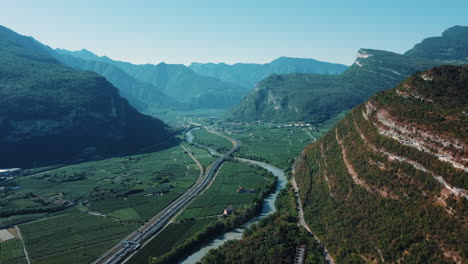 aerial view of a scenic valley with highway and vineyards