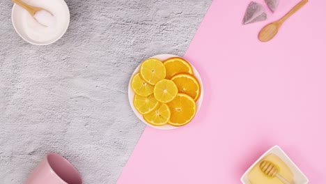 sliced lemons move in circle and supplies for making tea appear. stop motion