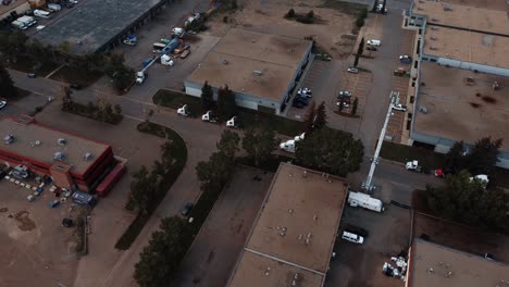 Fly-over-parked-semi-trucks-in-an-industrial-area