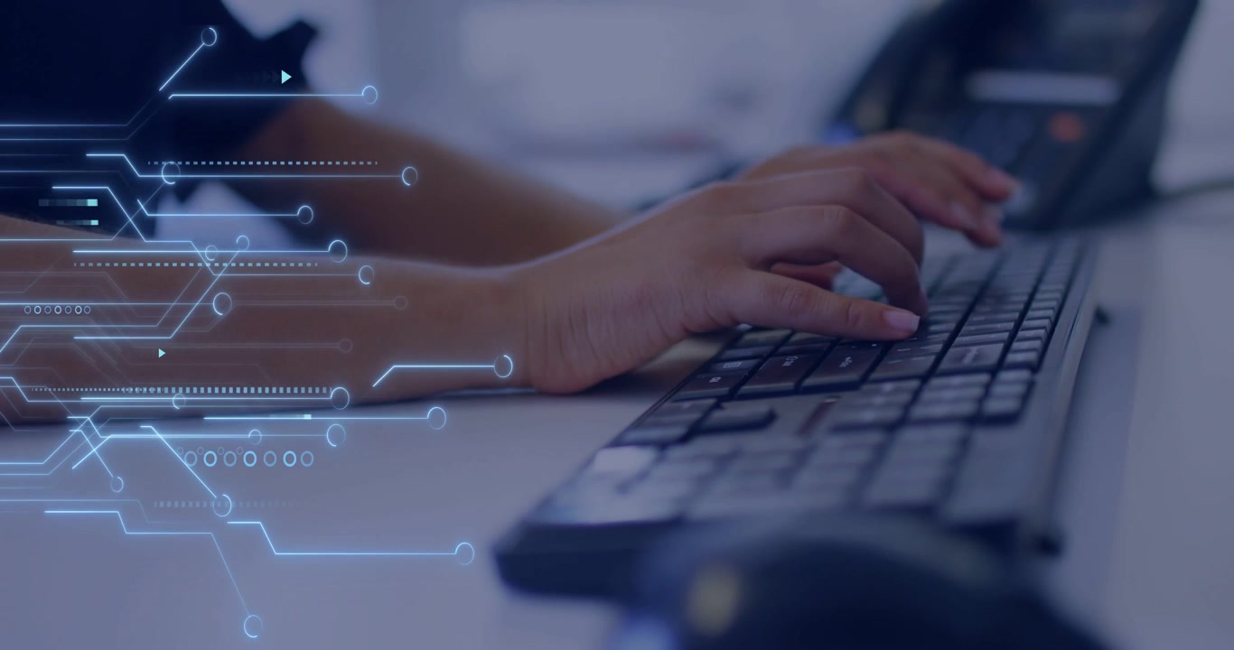 Female worker starting first key, entering data while circuit overlay animating across keyboard