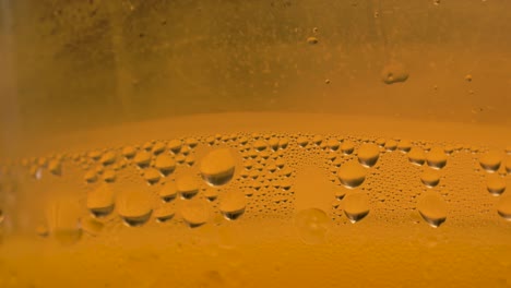 condensation on cold glass with bubbles and foam