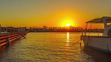 a beautiful timelapse of a port anchors at golden hour with a yacht