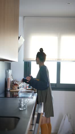 Woman Cooking in a Modern Kitchen