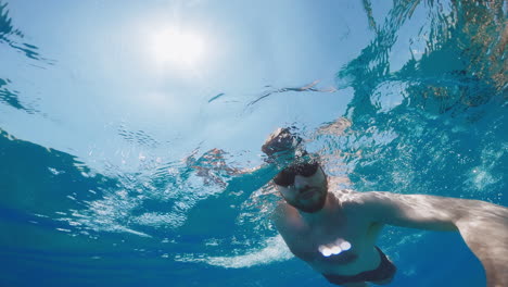 man swimming in the ocean