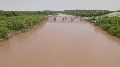 aerial footage of the red river flooding. cars can be seen driving across highway 35. this was taken may 31st, 2025