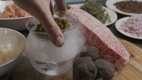 Caviar-being-placed-into-dry-ice-to-create-a-visual-effect