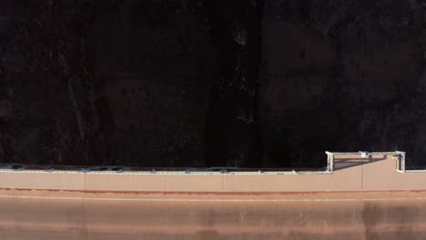 dynamic aerial tracking with bridge over large river gorge in desert