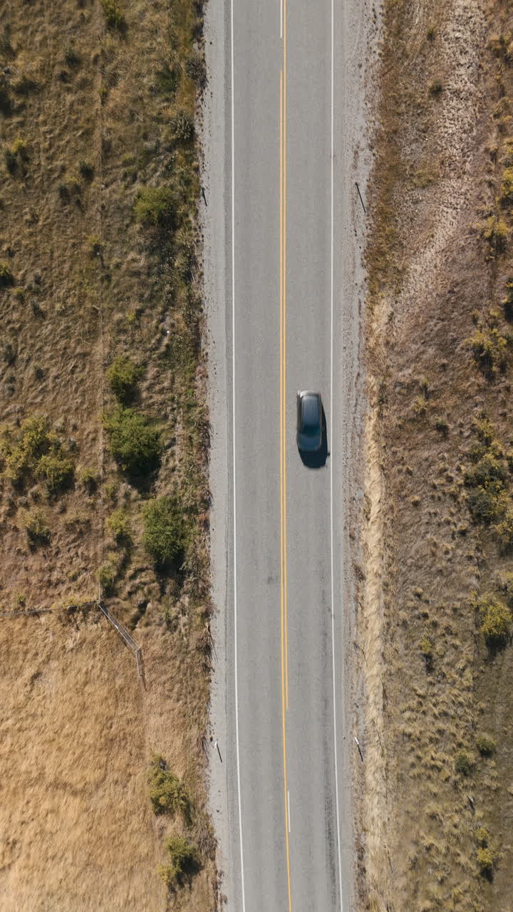 Aerial view of a country road with vehicles