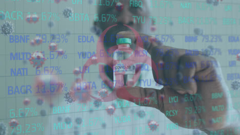 animation of covid 19 cells and data over african american male doctor holding vaccine