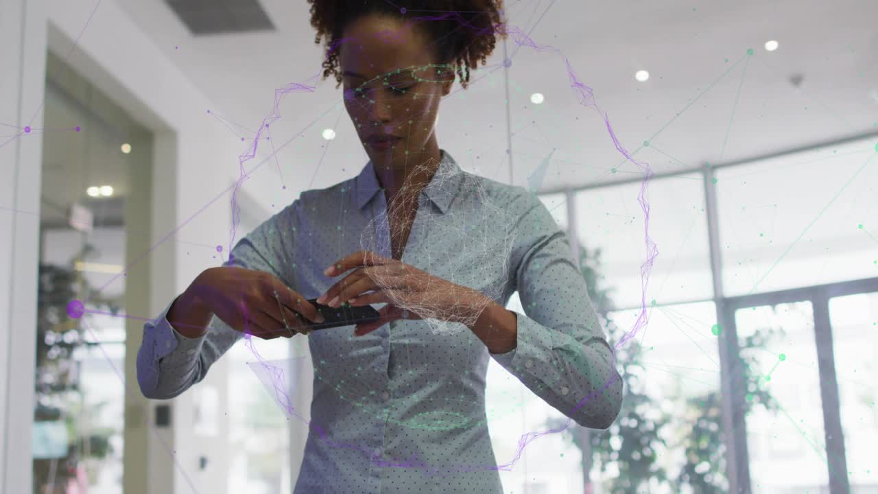 Business woman tapping foldable smartphone and unfolding screen for browsing by glass wall plants