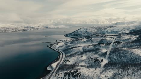 coastal mountainside road near lodingen in lofoten island in norway. aerial drone shot