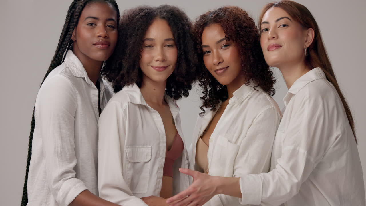 Four friends smiling and posing together