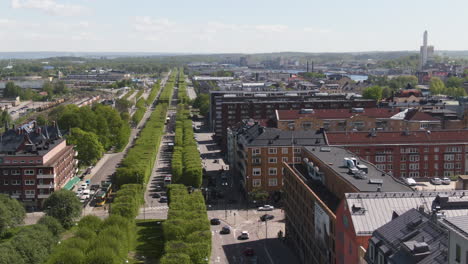 main alley road of norrkoping and cityscape, aerial side flying view