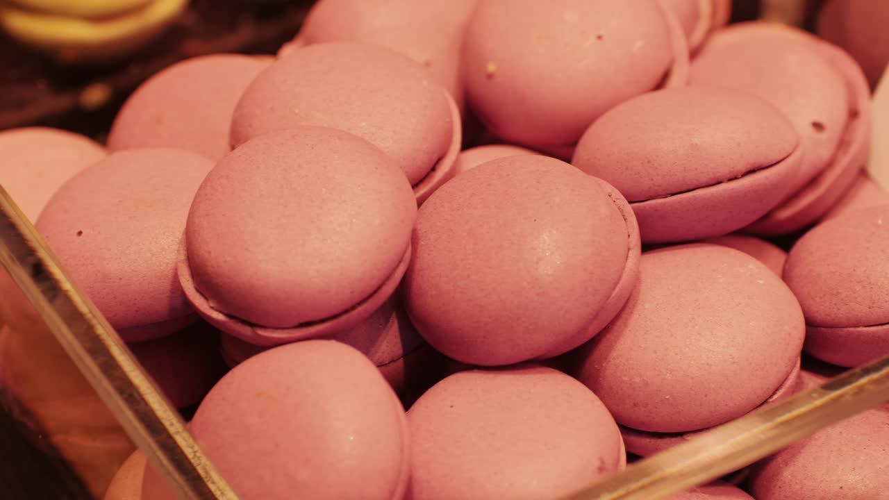A beautifully tempting display of pink macarons, which are perfect for desserts and all kinds of celebrations