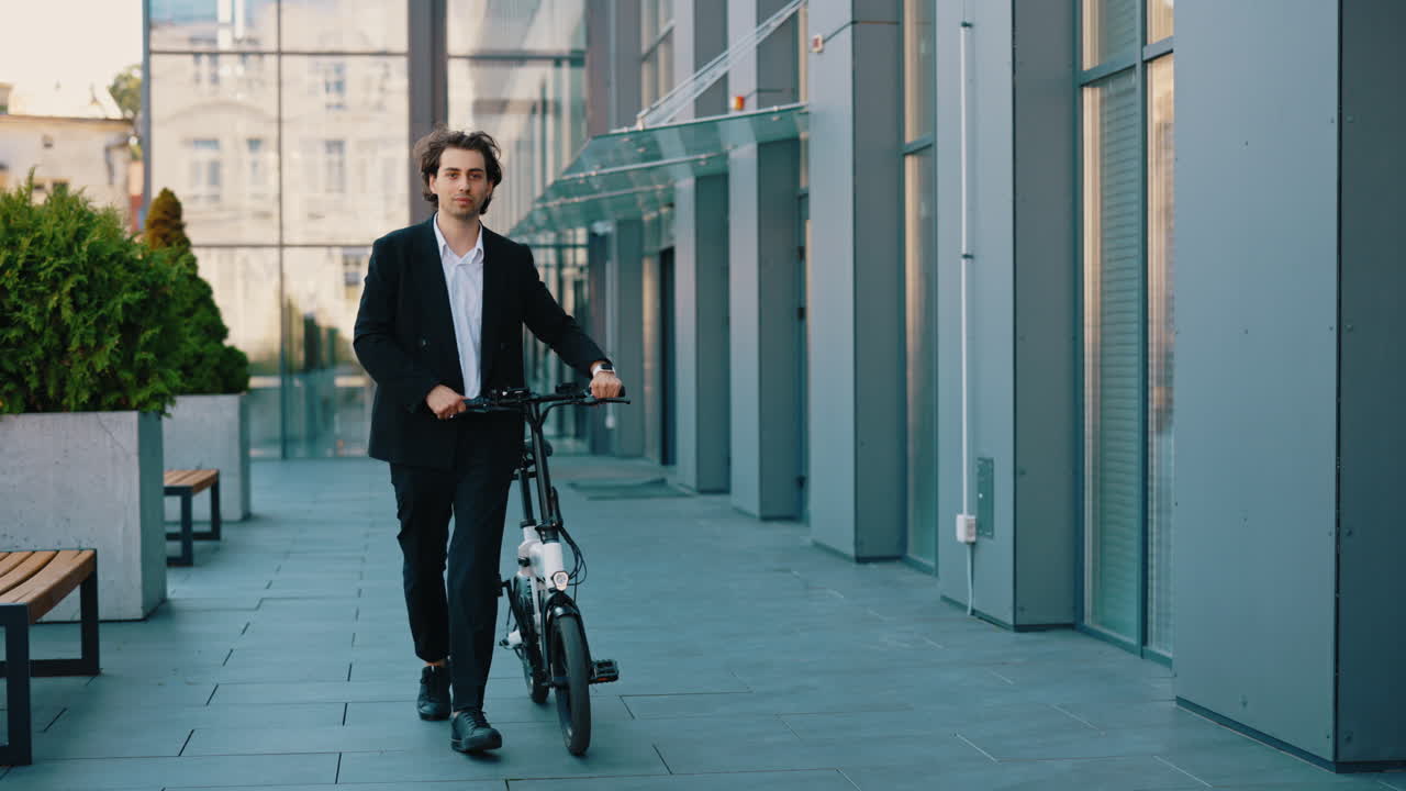 Businessman Walking an Electric Bicycle in the City