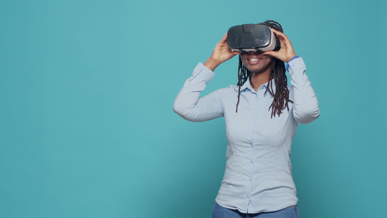 Portrait of woman using vr glasses on camera