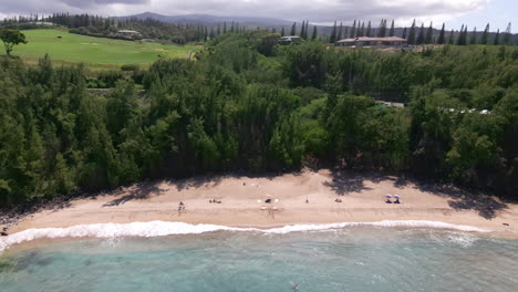 calm waves of pacific ocean wash slaughterhouse beach, maui