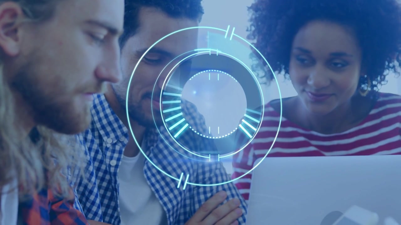 Laptop displaying rotating HUD overlay and tablet sitting on bright office meeting table