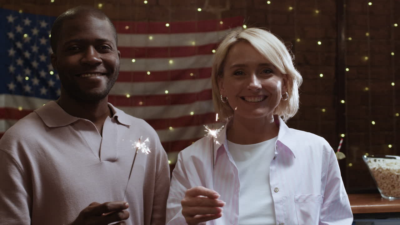 Couple Celebrating with Sparkler on Independence Day