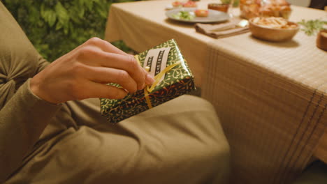 woman opening christmas gift