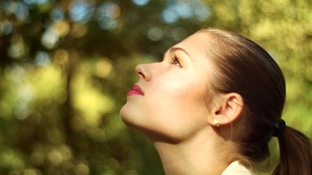 Woman in profile view outdoors