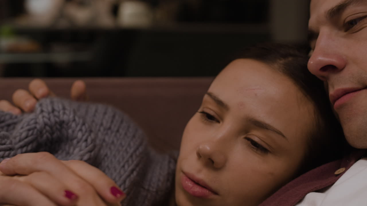 Couple Cozying Up with Tablet