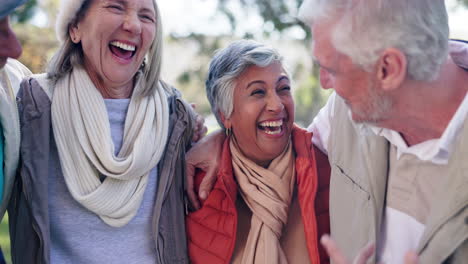 Group of happy senior friends laughing together outdoors