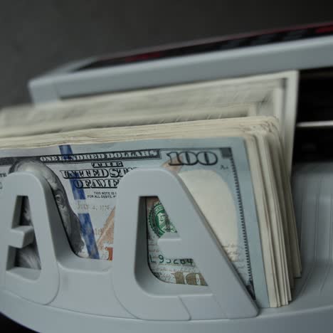 counting us dollars with a bill counter machine