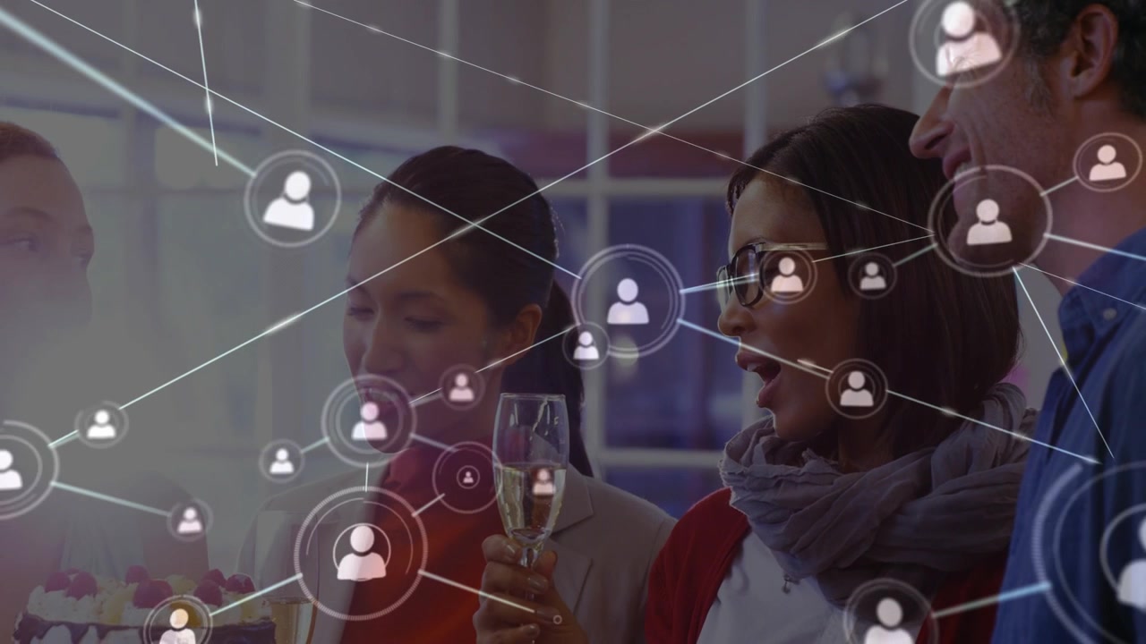 Business team presenting cake, causing animated user-icon network expanding while holding glasses
