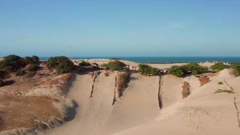 Aerial:-Sand-and-waterslides-in-the-dunes-of-Cumbuco,-Brazil