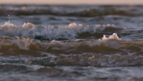 Sea-waves-rushing-at-the-beach-during-sunset