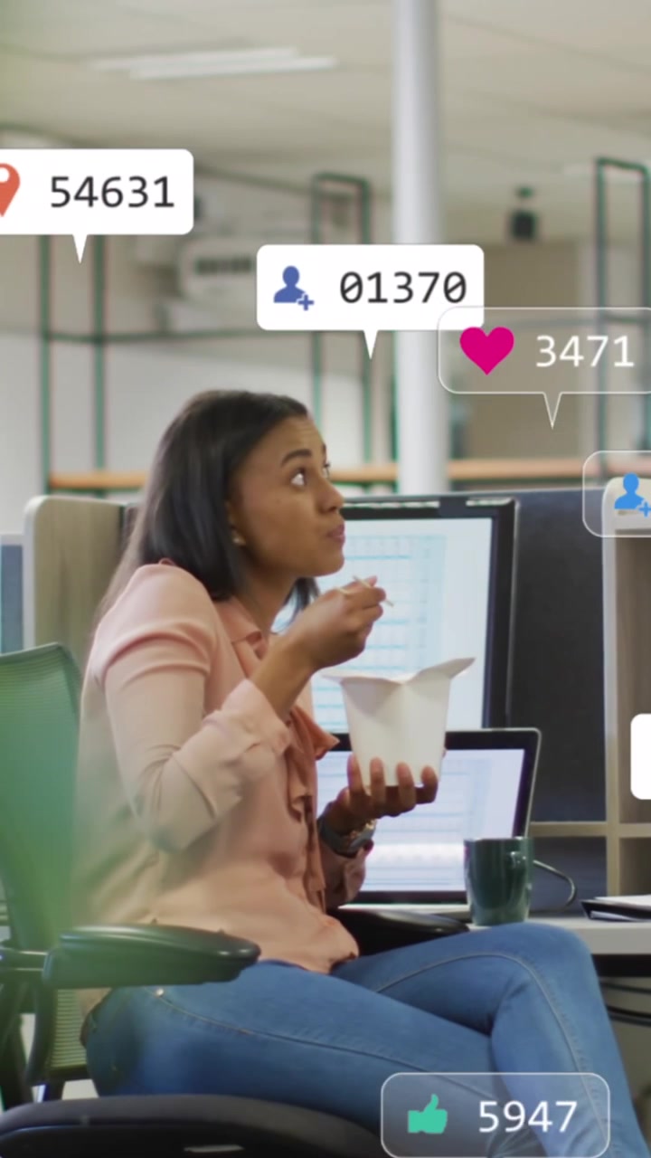 Animation of social media notifications over diverse male and female office colleagues talking