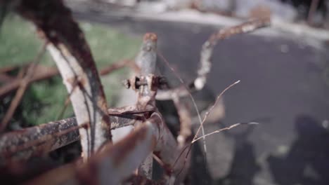 abandoned children's bicycle in a burnt down apartment complex - aftermath of wildfire - slow motion