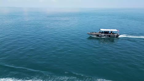 Drone-view-of-Boats-Divers-on-Celebes-Sea,-Sabah,-Malaysia