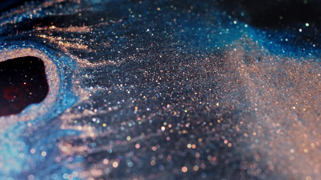 Colorful substances blend in mesmerizing macro close-up video
