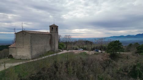 Historic-Church-of-Sant-Pere-de-Casserres-amidst-lush-landscape-in-Barcelona,-Spain